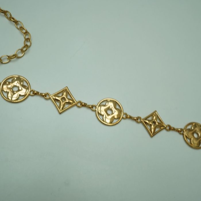 cinto dourado LV